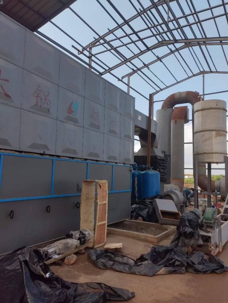 Taiguo engineers performing precision welding on an industrial biomass boiler steam header